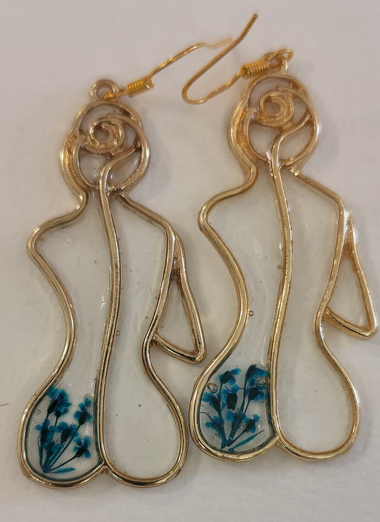 Female silhouette earrings with blue flowers